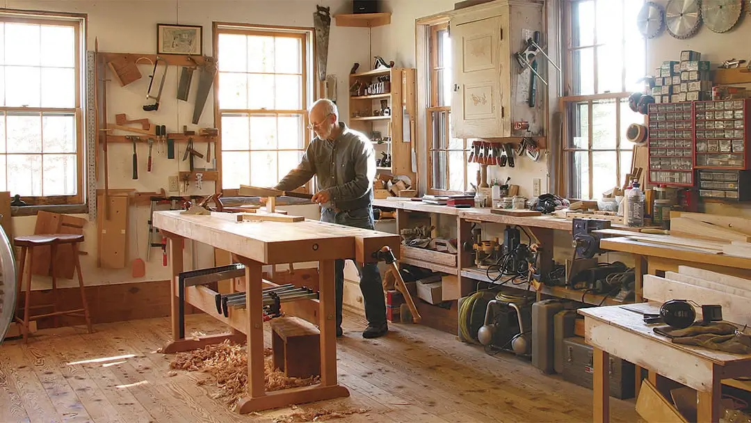 A craftsman's workshop with tools and raw materials.